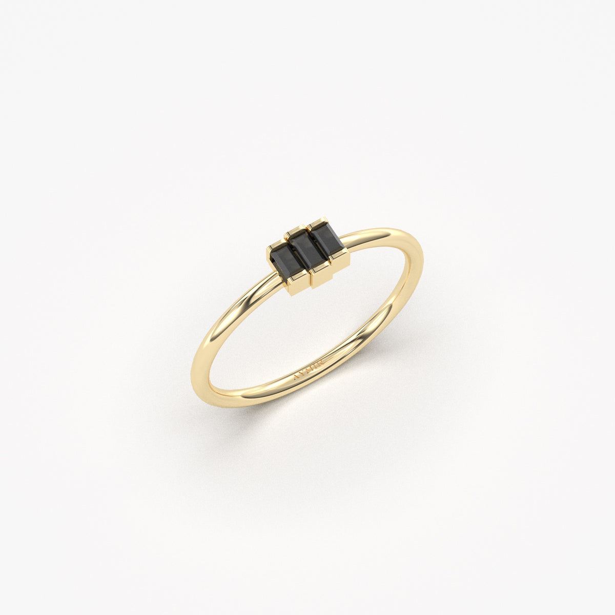 Yellow gold black onyx three-baguette ring, angled view