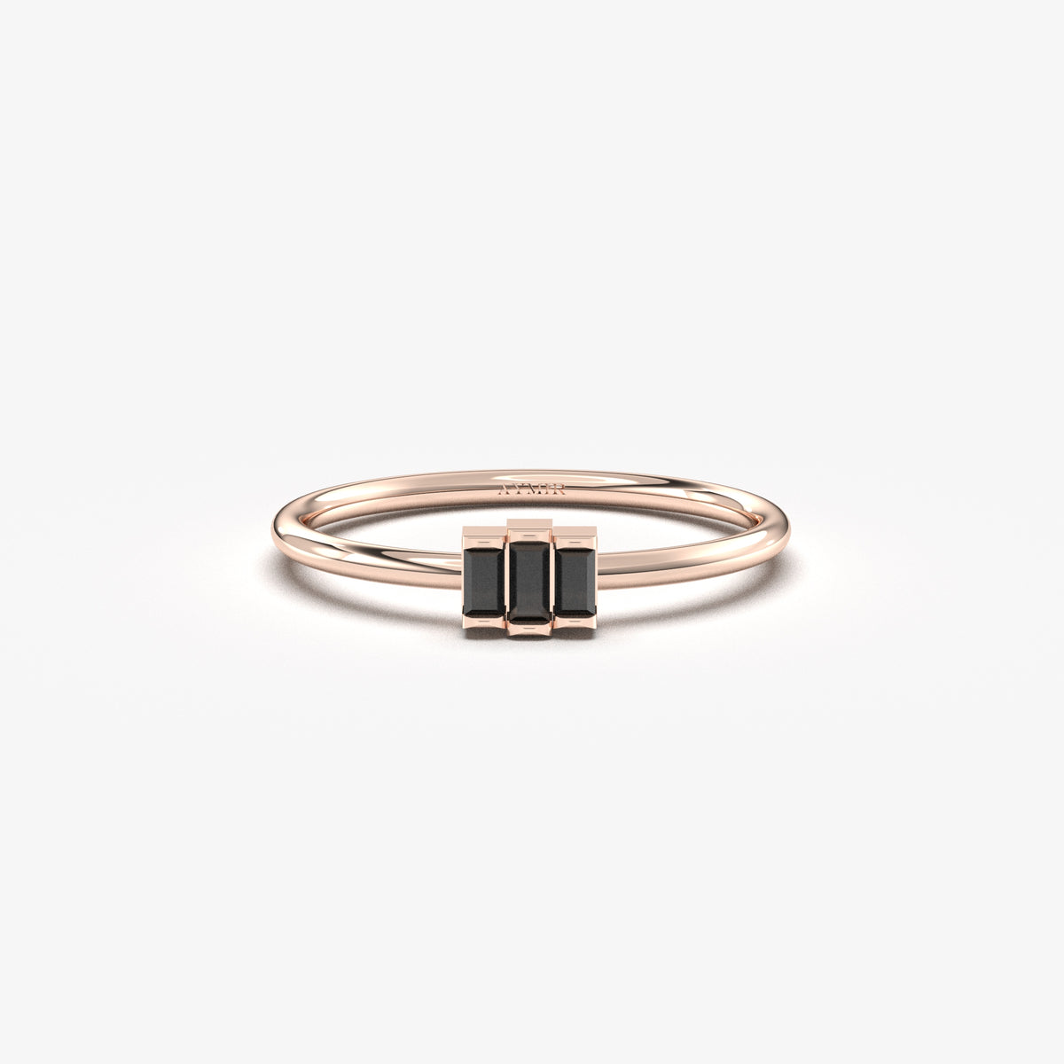 Rose gold black onyx three-baguette ring, front view