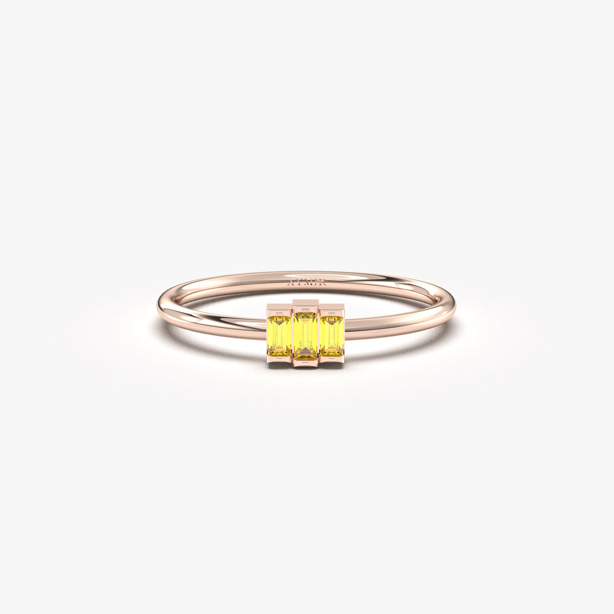 Rose gold yellow-stone three-baguette ring, front view