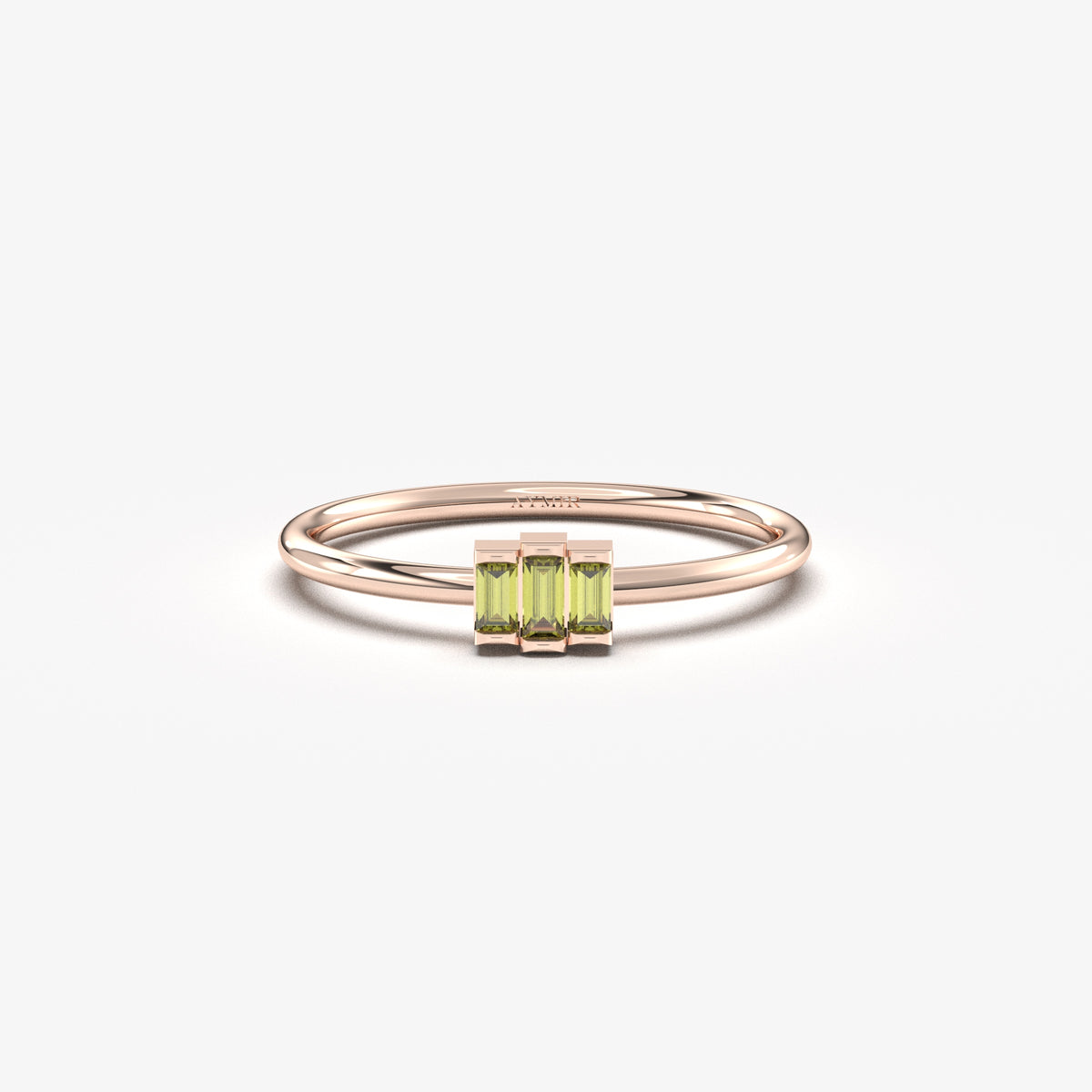 Rose gold green-stone three-baguette ring, front view