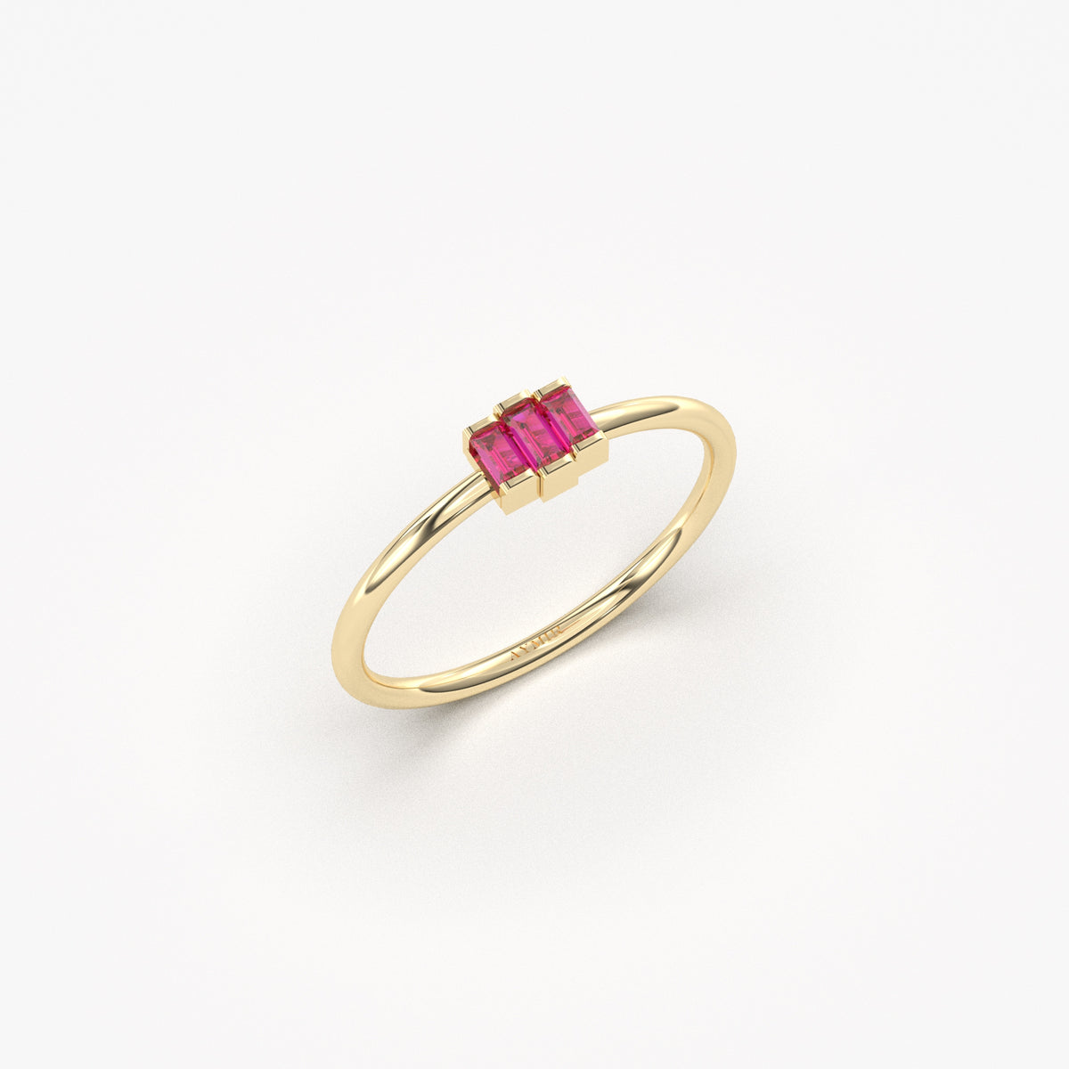 Yellow gold red-stone three-baguette ring, angled view