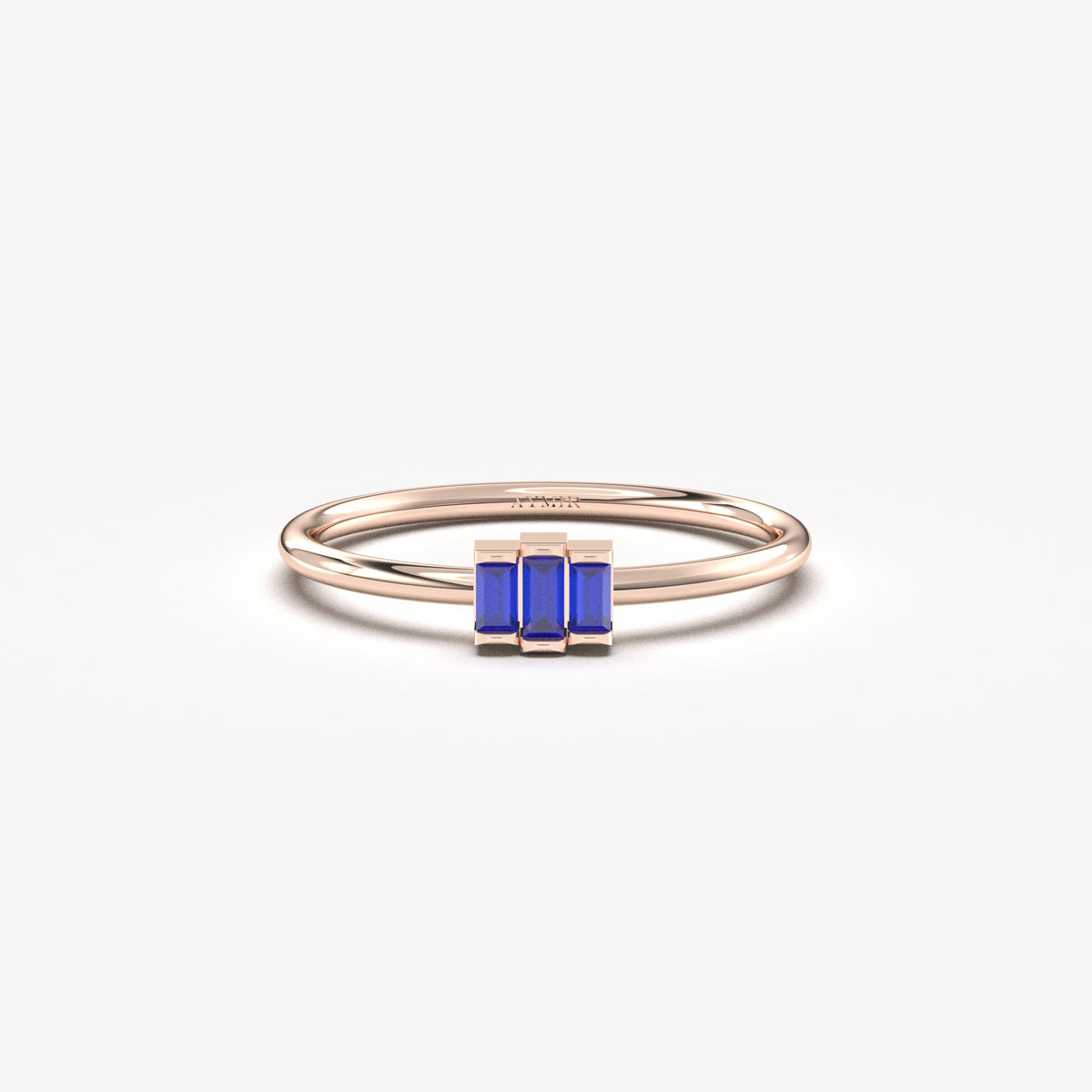 Rose gold blue-stone three-baguette ring, front view