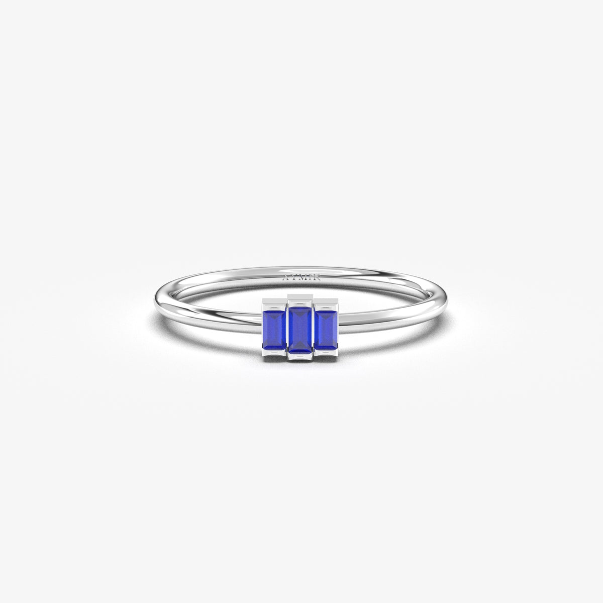 White gold blue-stone three-baguette ring, front view