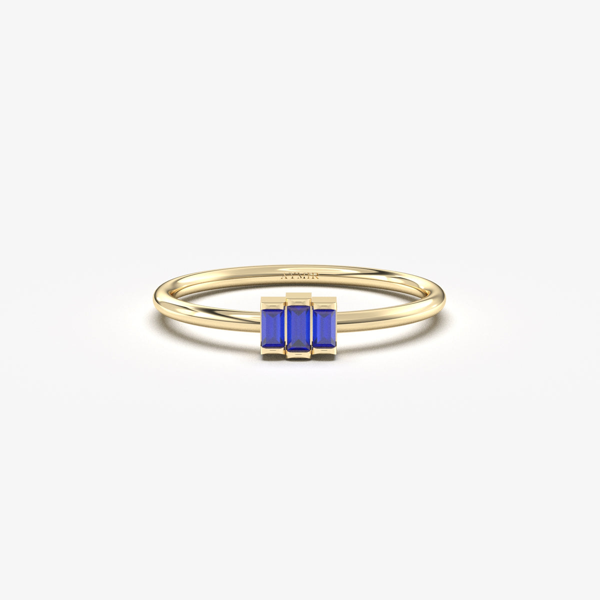 Yellow gold blue-stone three-baguette ring, front view