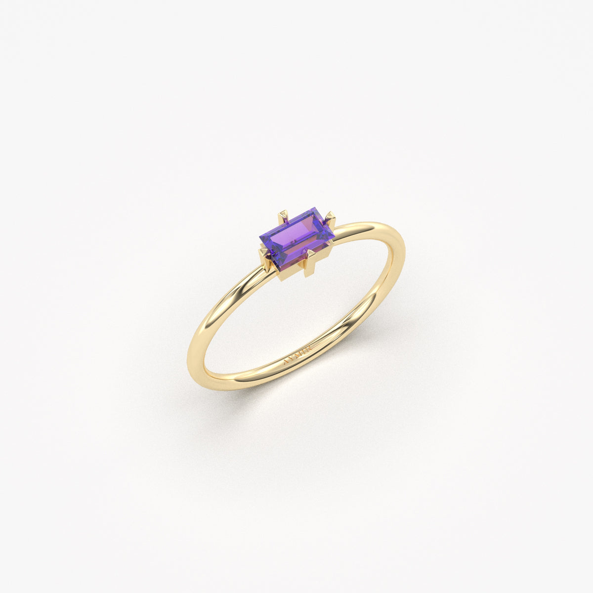 Yellow gold purple-stone baguette solitaire ring, angled view