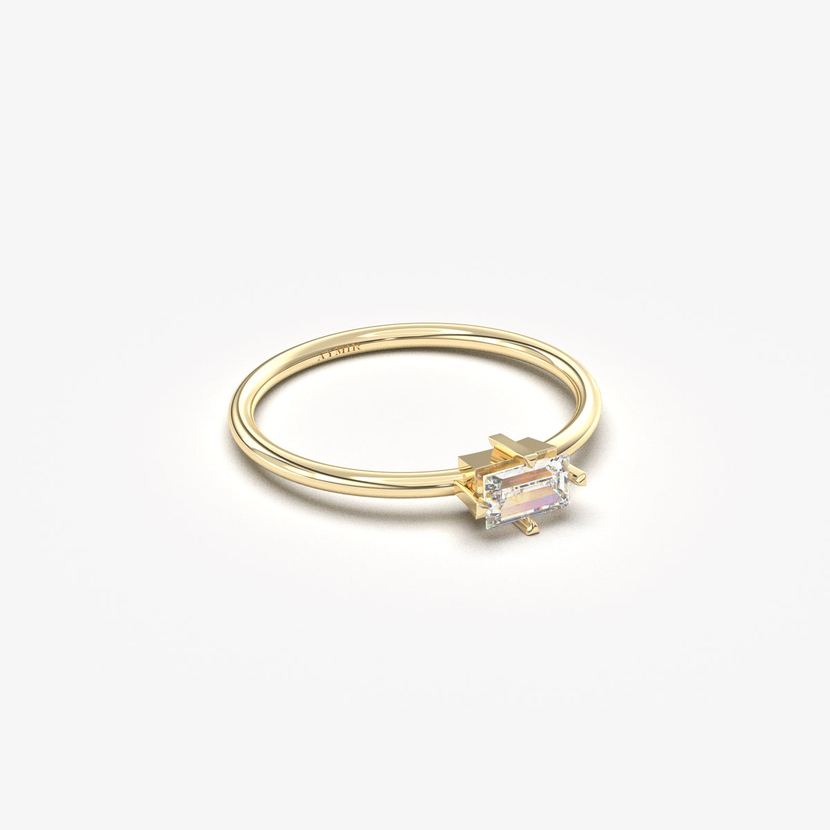 Yellow gold white-stone baguette solitaire ring, side view