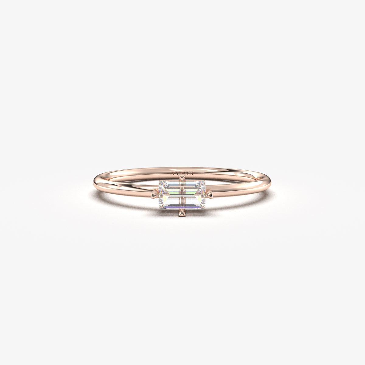 Rose gold white-stone baguette solitaire ring, front view