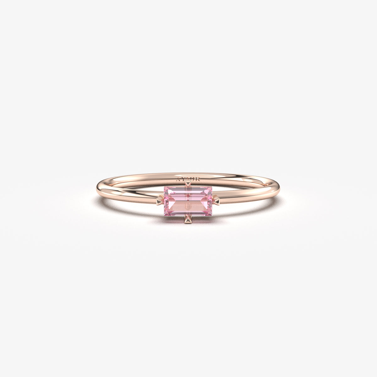Rose gold pink-stone baguette solitaire ring, front view