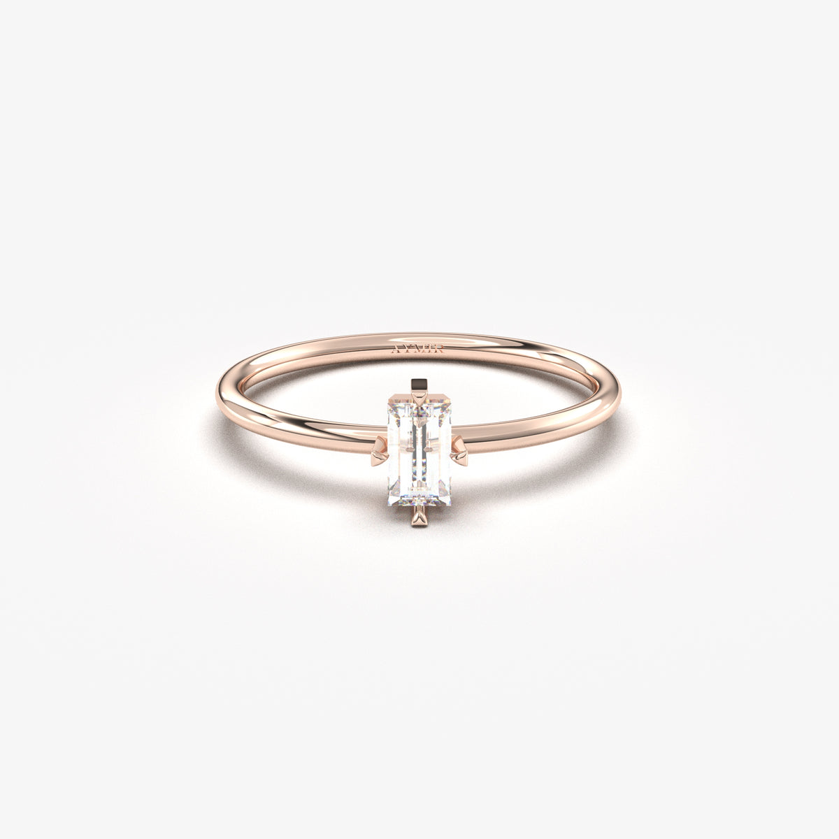 Rose gold white-stone baguette solitaire ring, front view