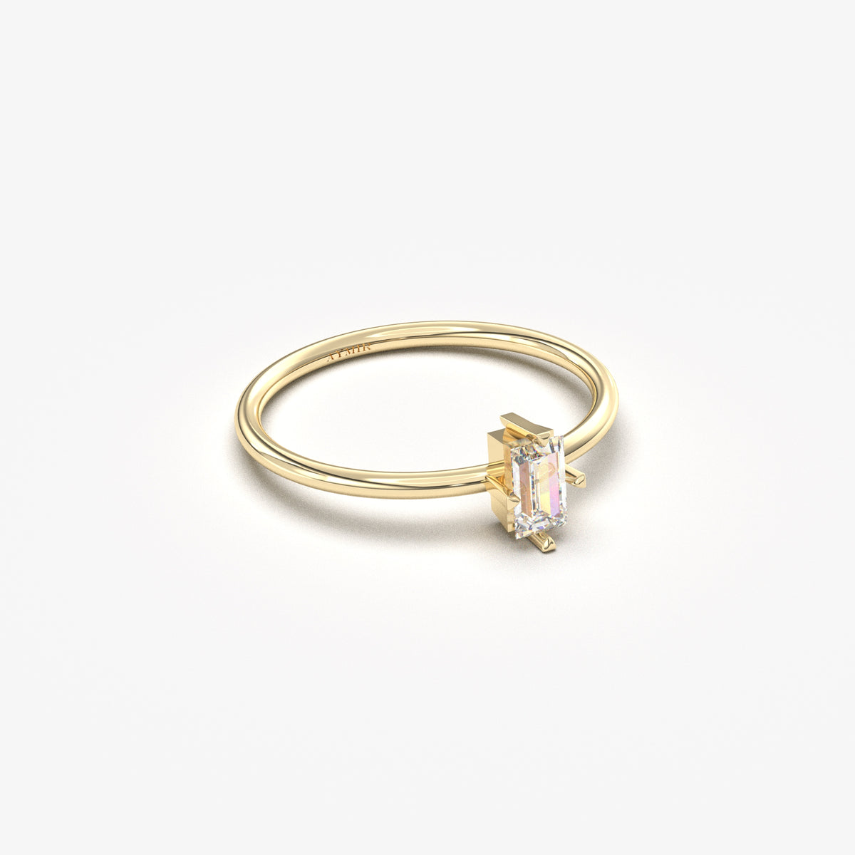 Yellow gold white-stone baguette solitaire ring, side view