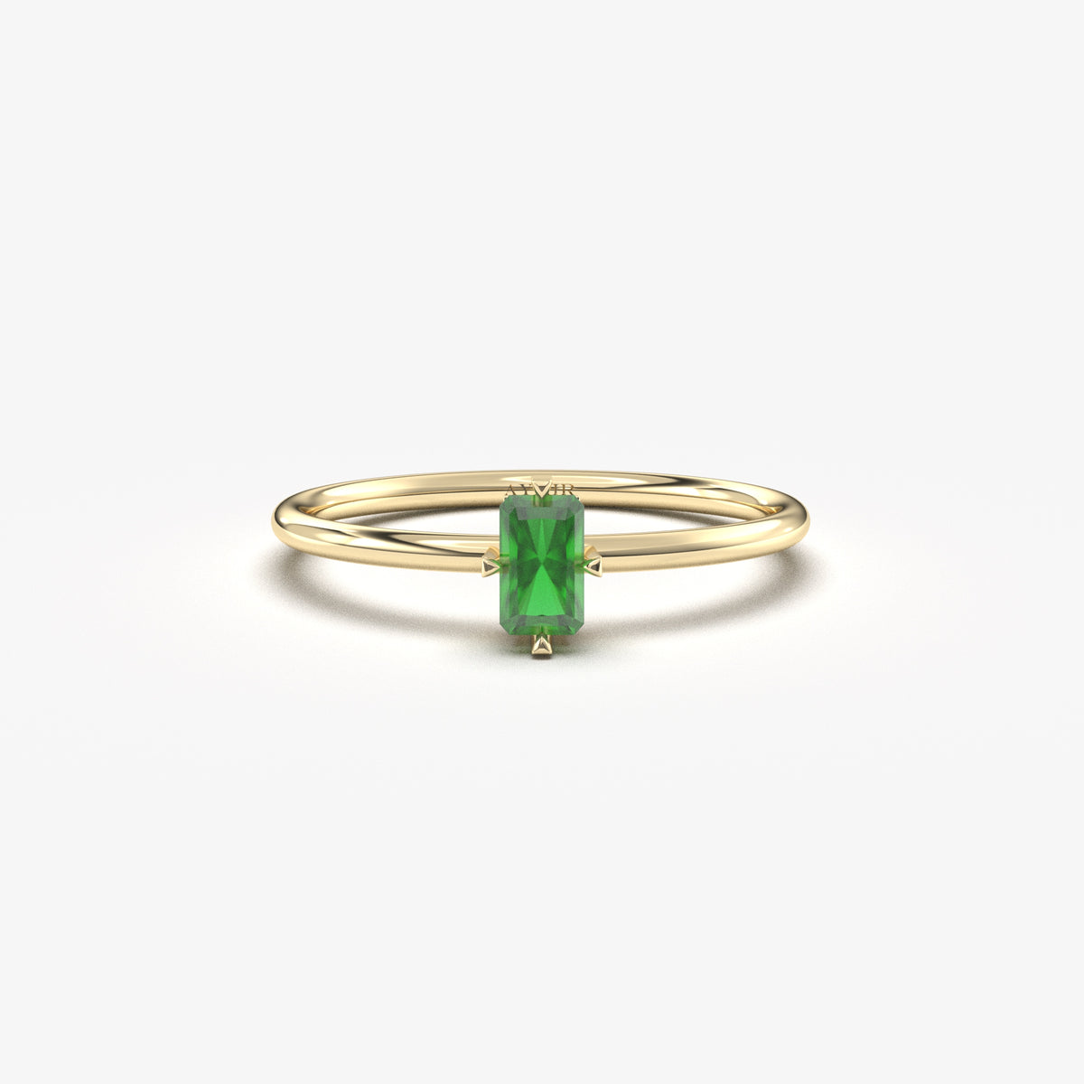 Yellow gold green-stone baguette solitaire ring, front view