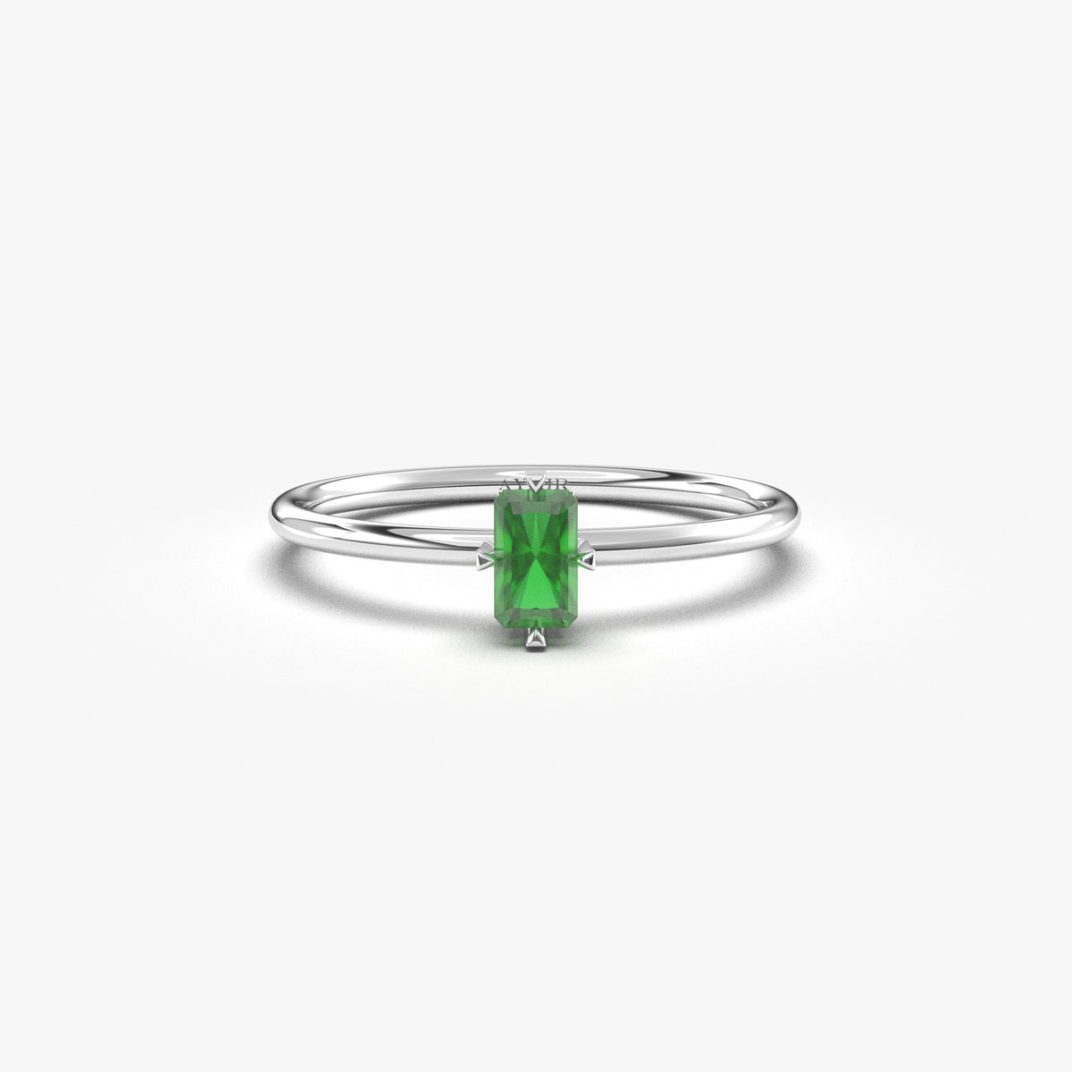 White gold green-stone baguette solitaire ring, front view