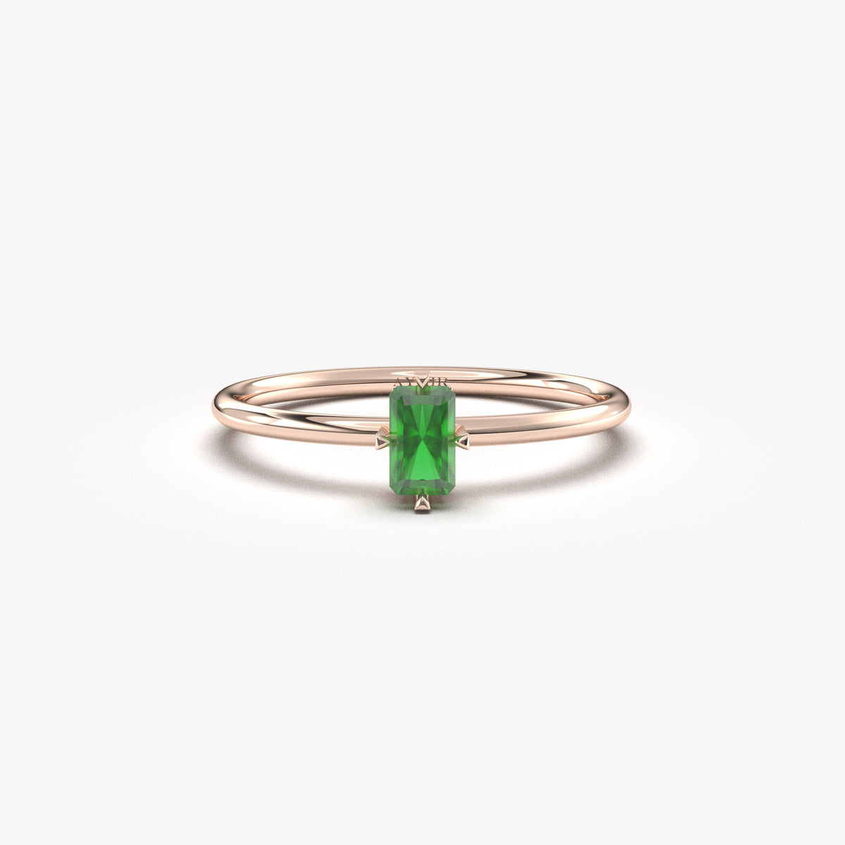 Rose gold green-stone baguette solitaire ring, front view