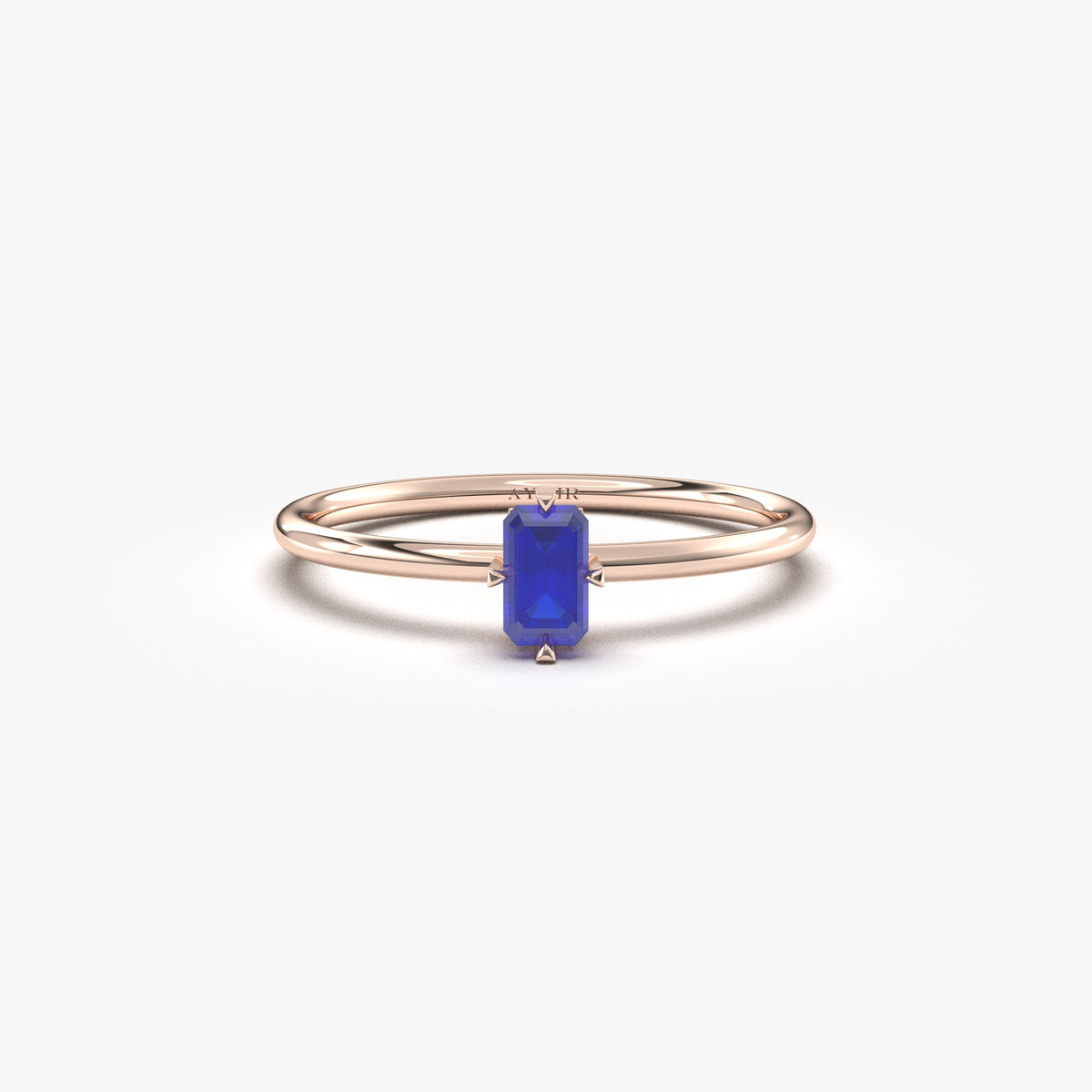 Rose gold blue-stone baguette solitaire ring, front view