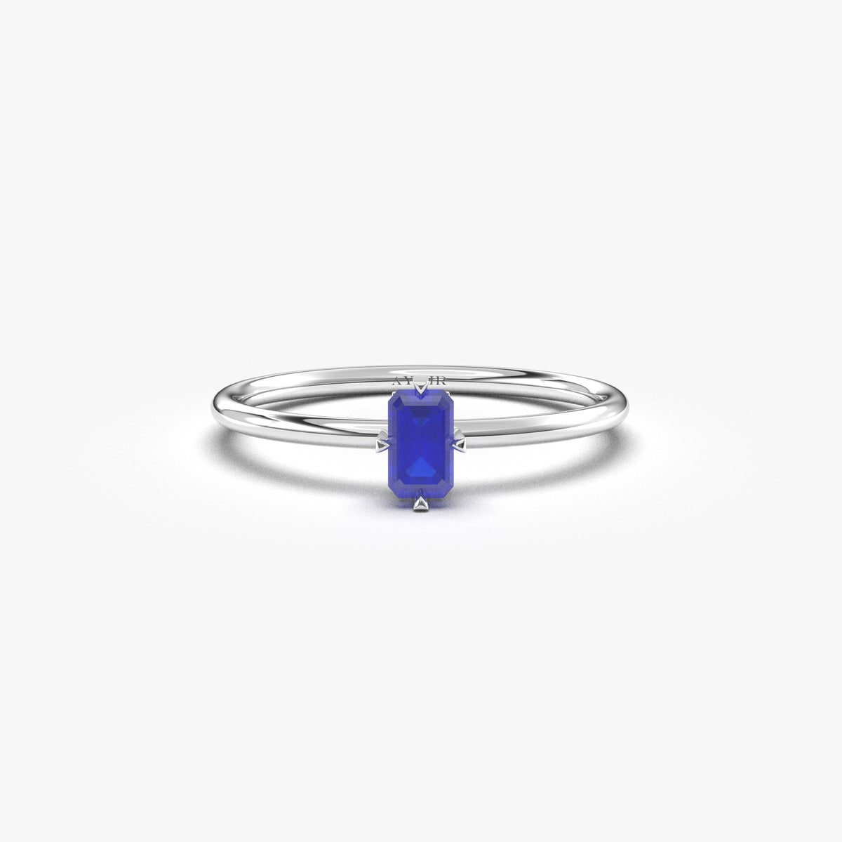 White gold blue-stone baguette solitaire ring, front view