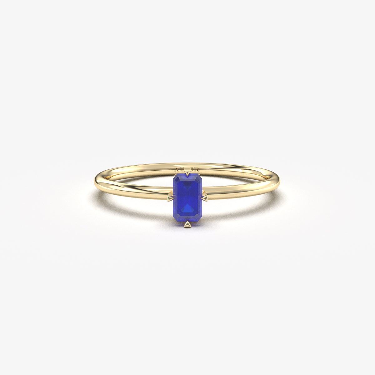 Yellow gold blue-stone baguette solitaire ring, front view