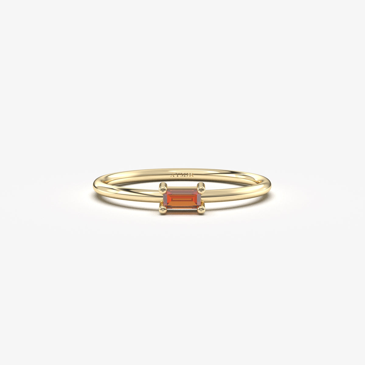 Yellow gold dark-red-stone baguette solitaire ring, front view