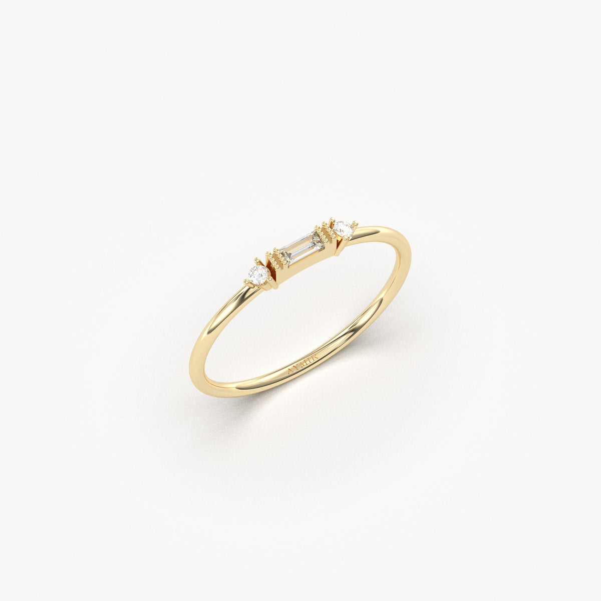 Yellow gold bezel baguette ring, angled view