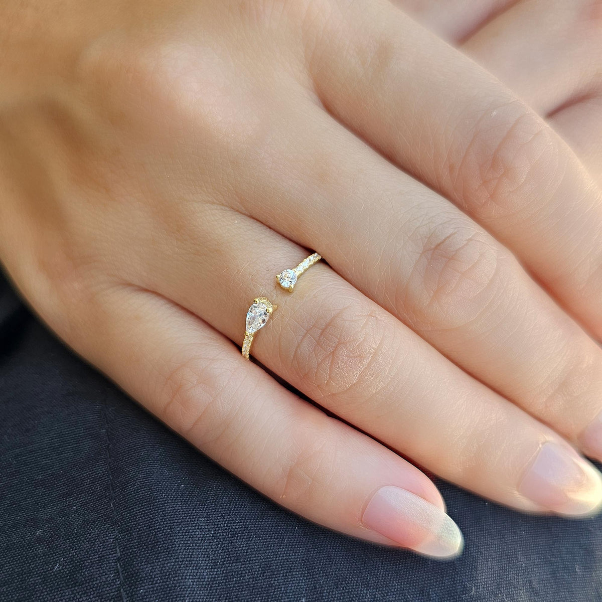 Gold pear open ring worn on hand