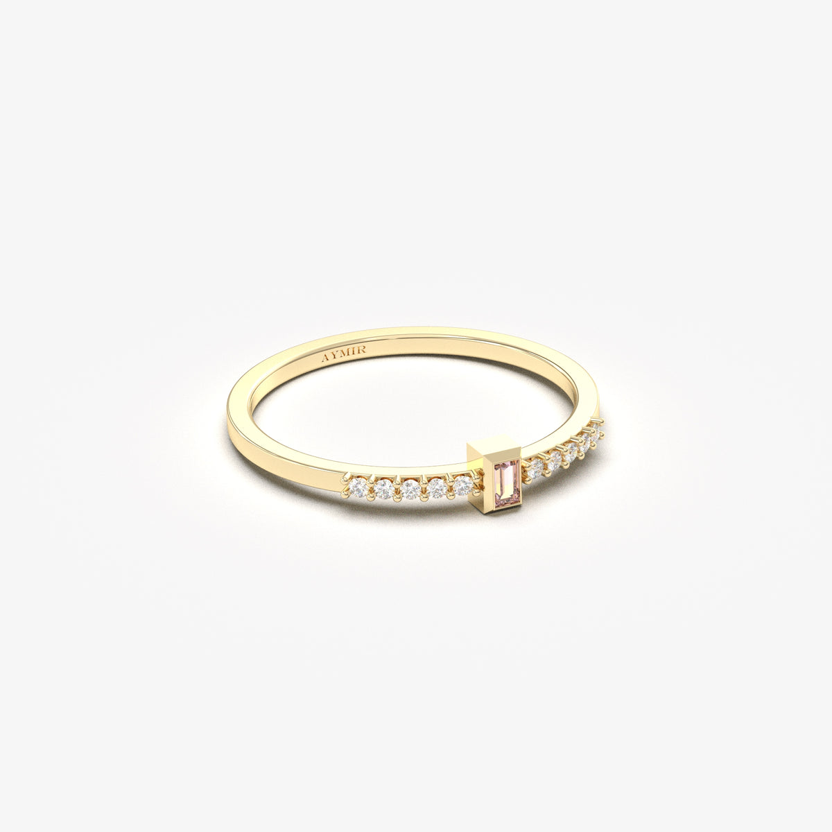 Yellow gold pink-stone baguette ring, angled view