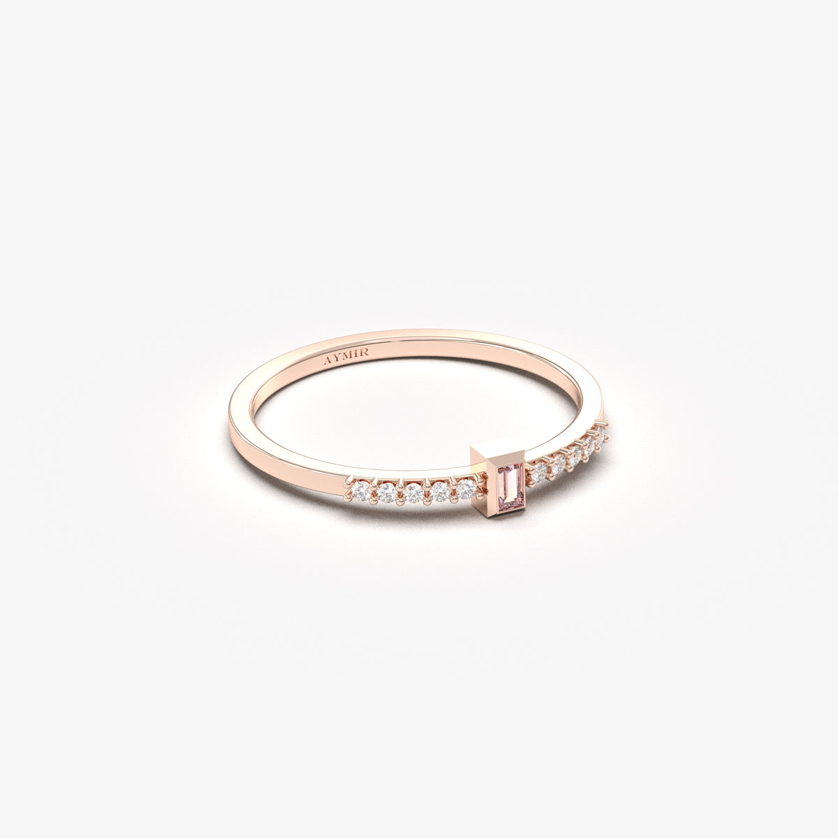 Rose gold pink-stone baguette ring, angled view