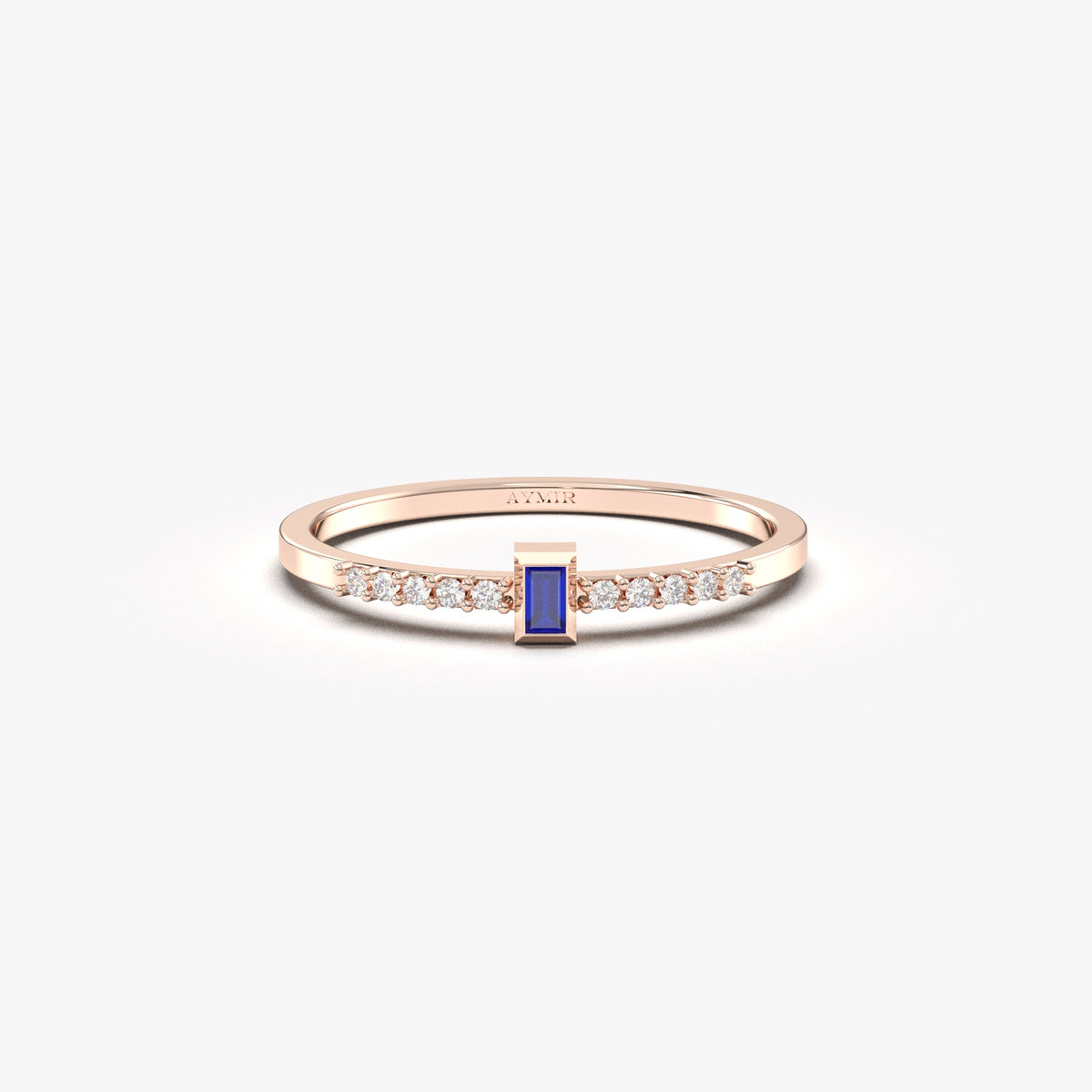 Rose gold blue-stone baguette ring, front view