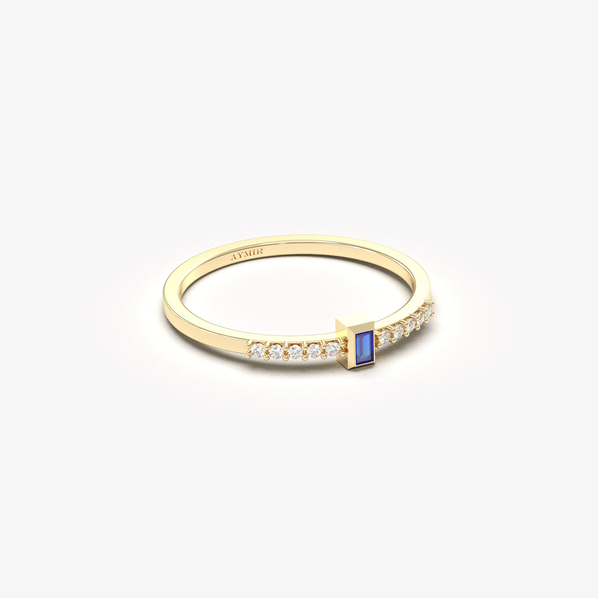 Yellow gold blue-stone baguette ring, side view