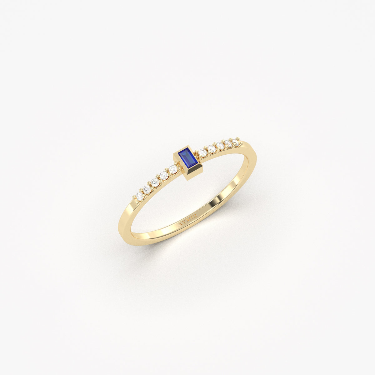 Yellow gold blue-stone baguette ring, angled view