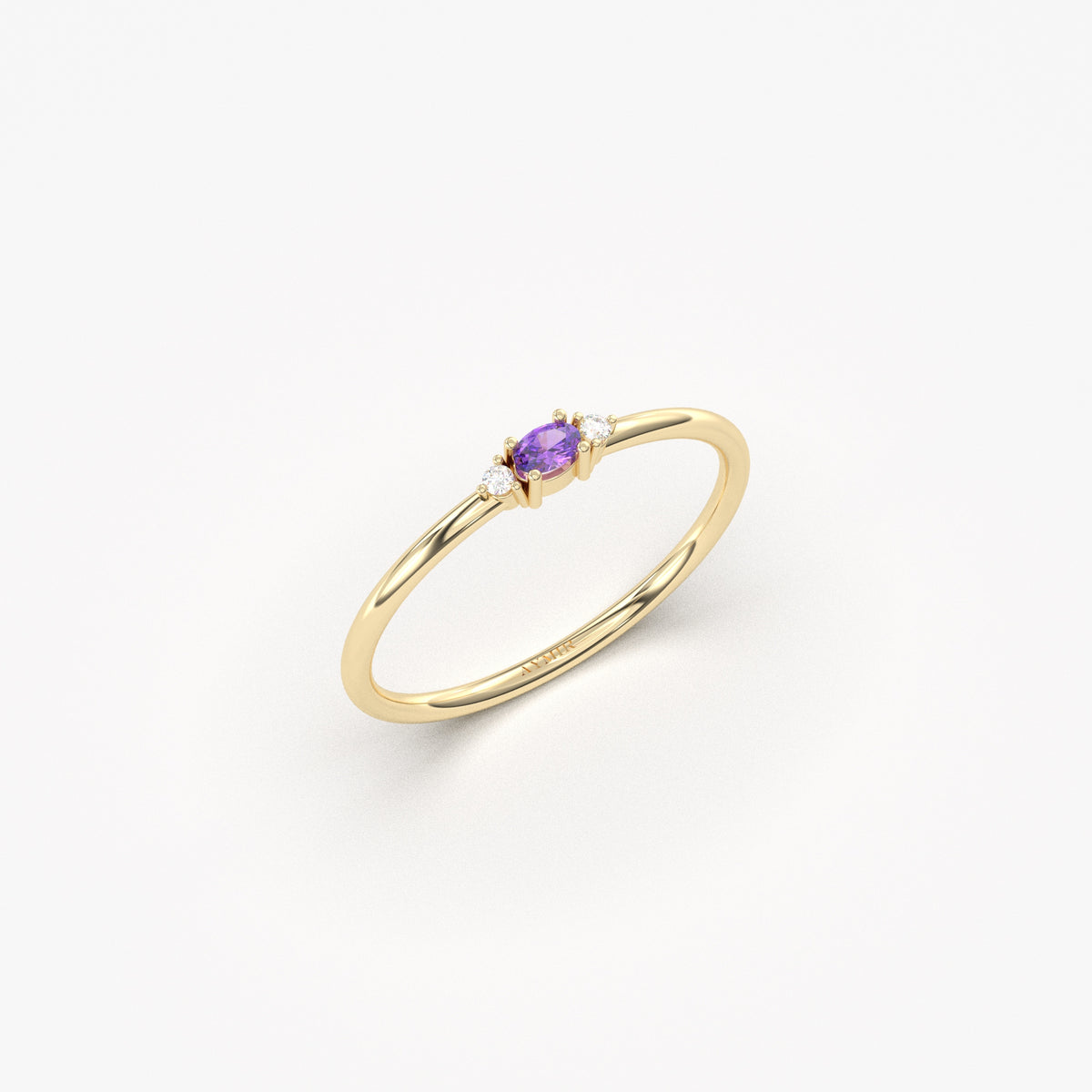 Yellow gold purple-stone three-stone oval ring, angled view