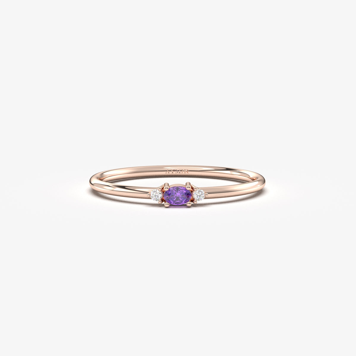 Rose gold purple-stone three-stone oval ring, front view