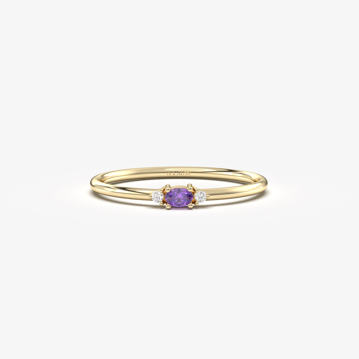 Yellow gold purple-stone three-stone oval ring, front view