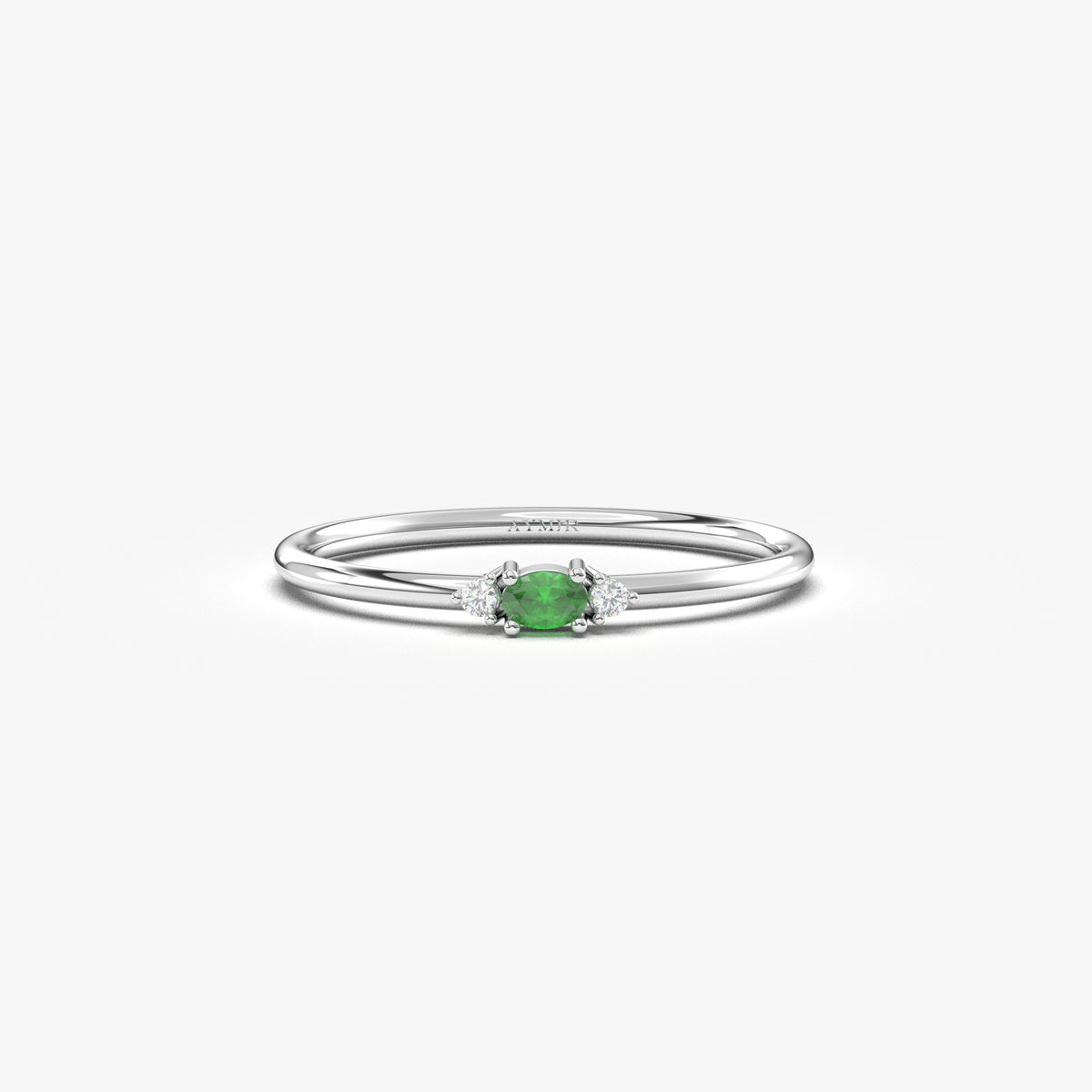 White gold green-stone three-stone oval ring, front view
