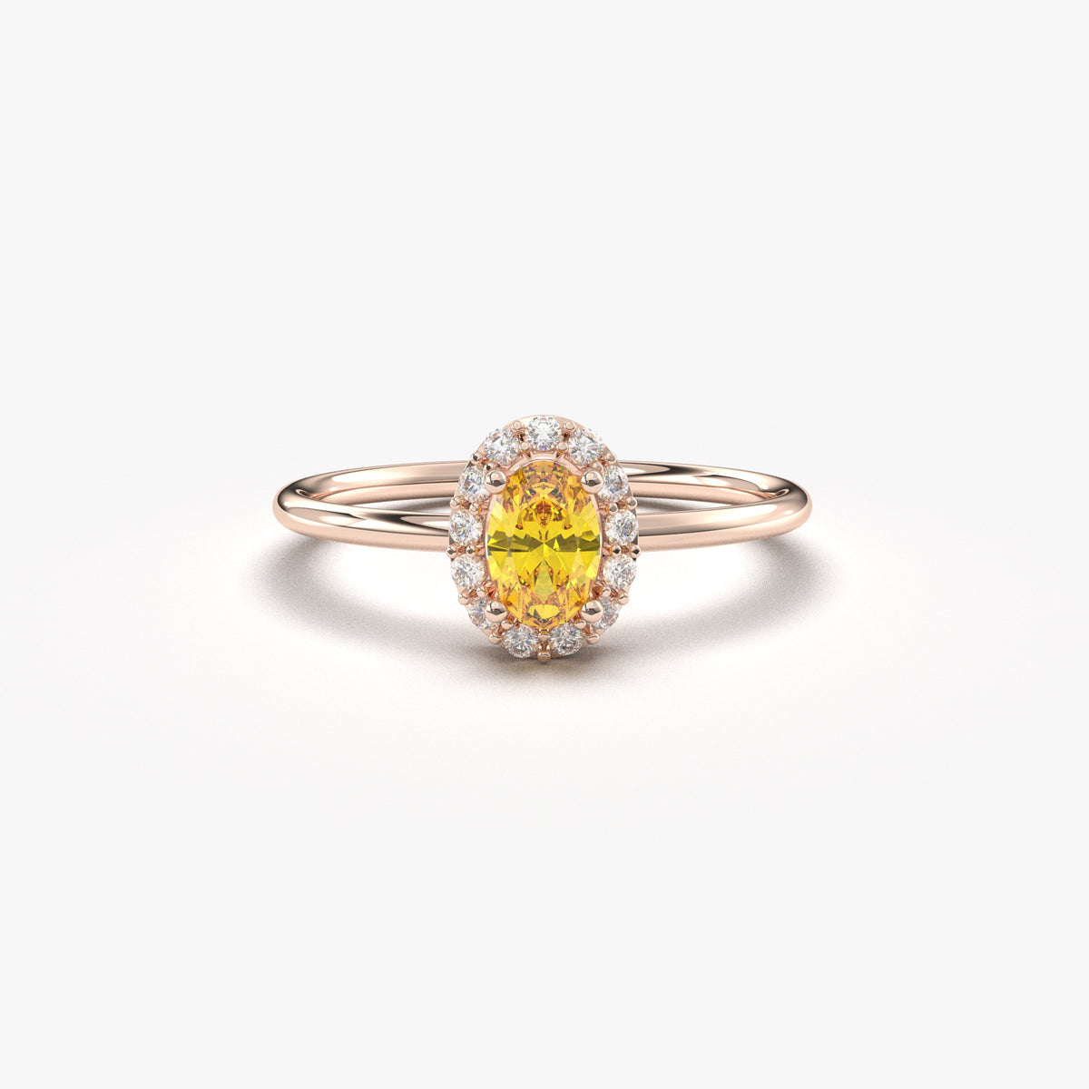 Rose gold yellow-stone oval halo ring, front view