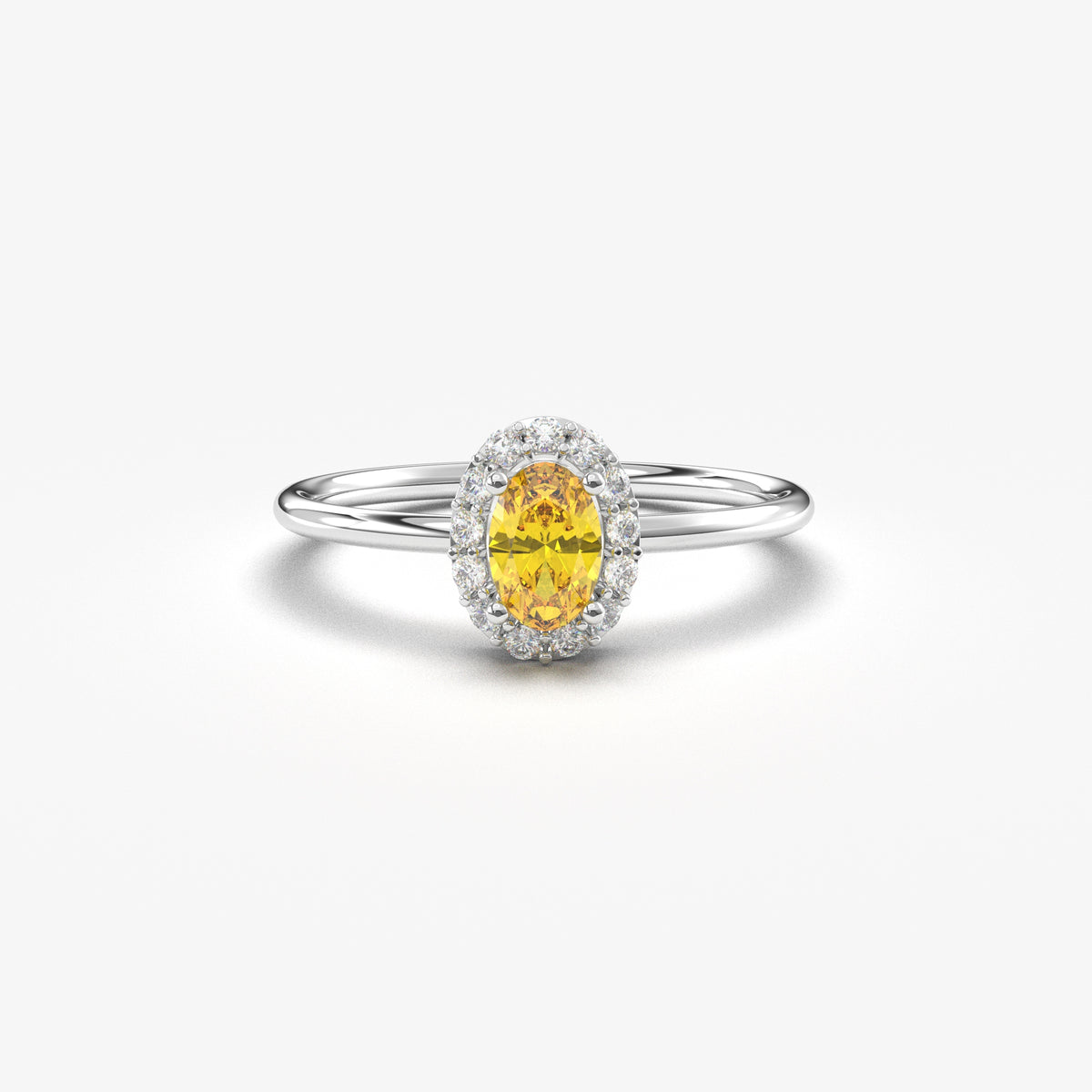 White gold yellow-stone oval halo ring, front view