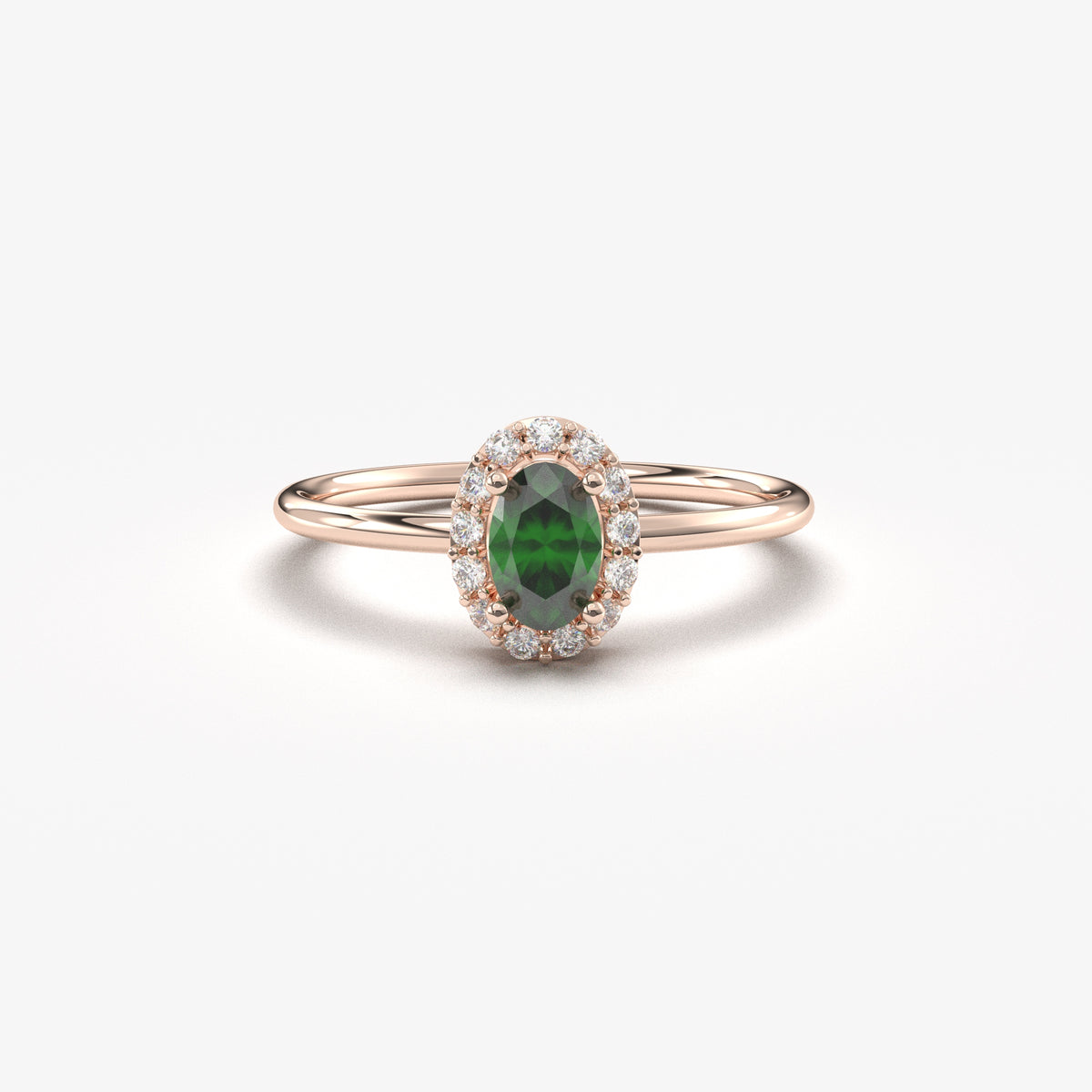 Rose gold green-stone oval halo ring, front view