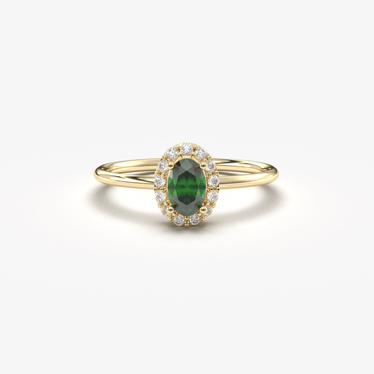 Yellow gold green-stone oval halo ring, front view