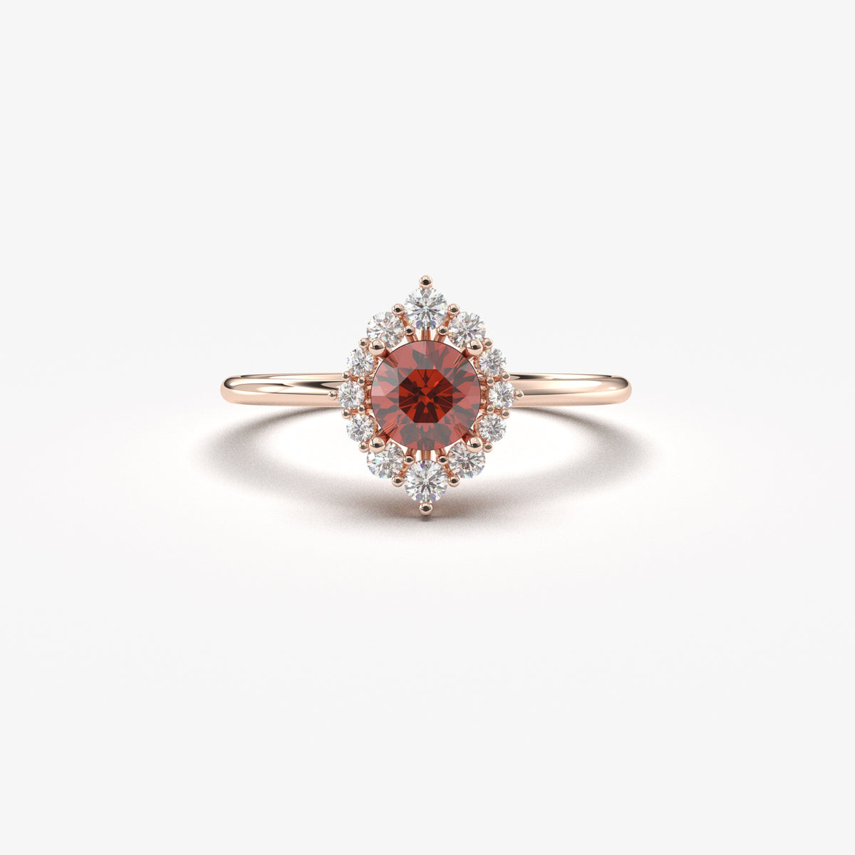 Rose gold dark-red-stone round halo ring, front view