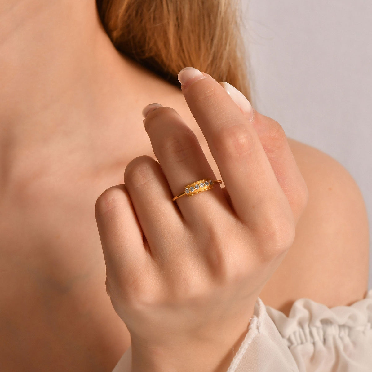 18K gold modern six stone cubic zirconia ring worn on hand
