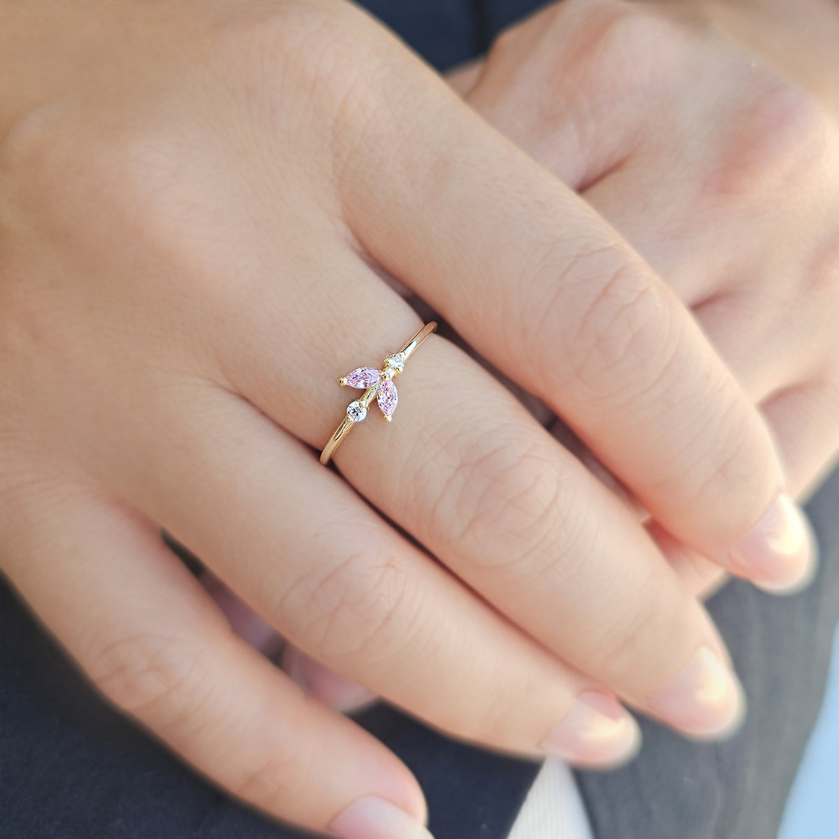 Gold pink-stone marquise leaf ring worn on hand