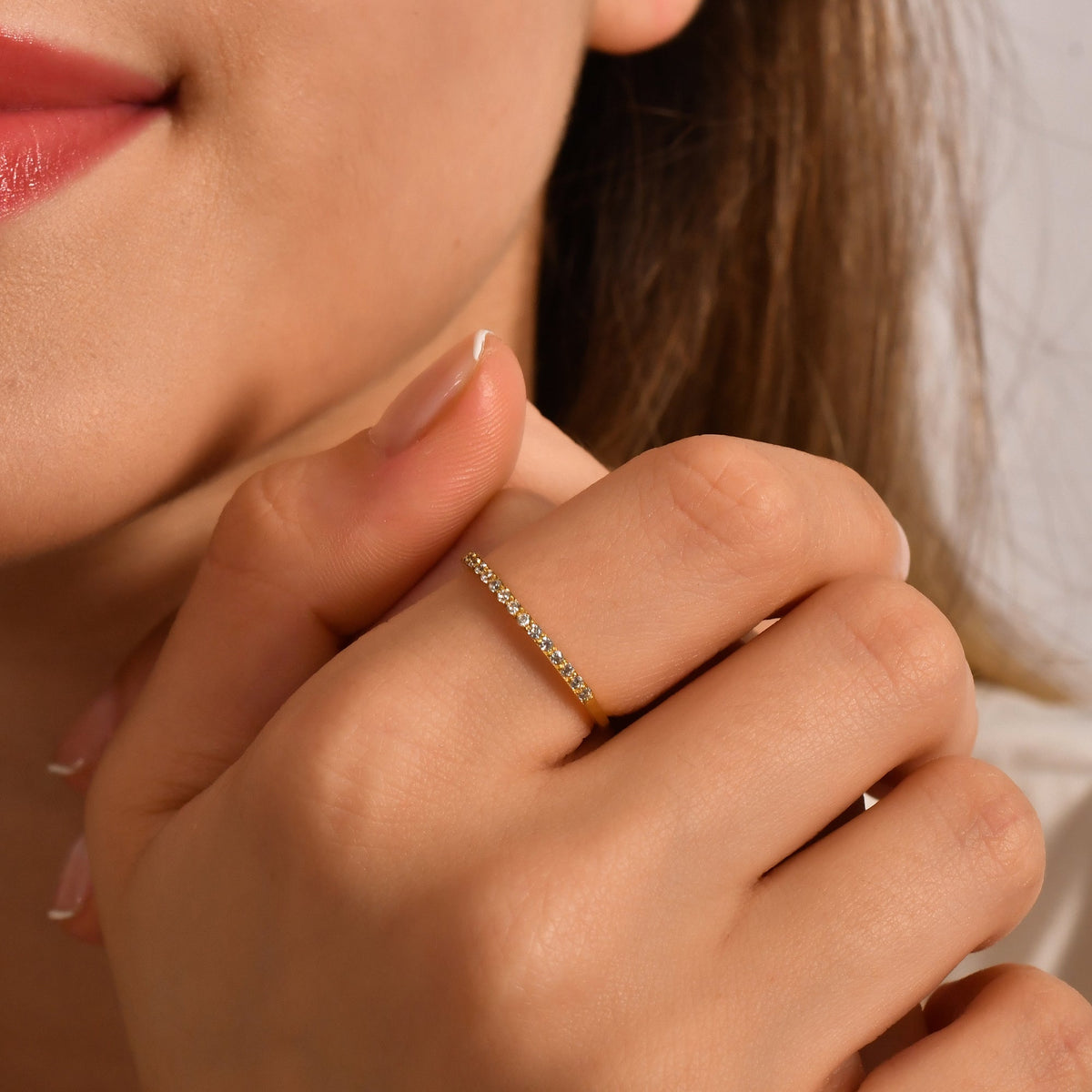 10K gold milgrain half eternity cubic zirconia ring worn on hand
