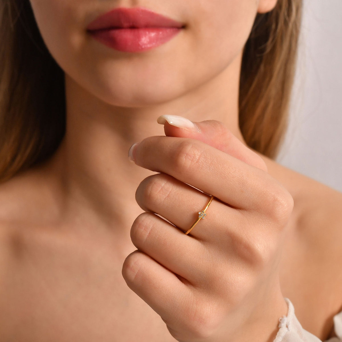 10K gold mini star cubic zirconia ring worn on hand
