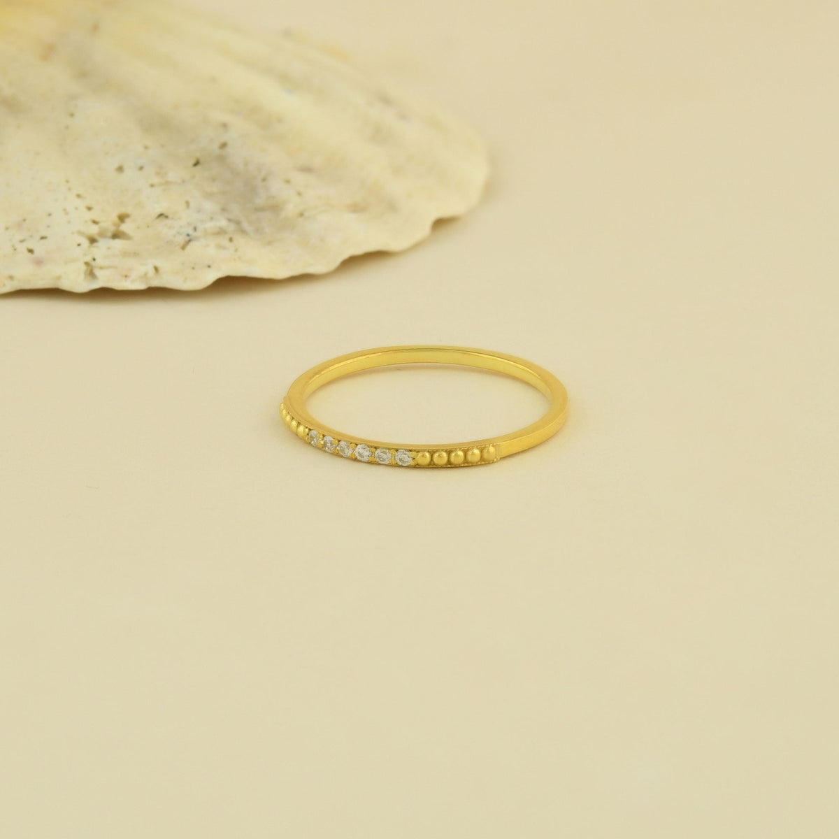 18K gold beaded milgrain diamond ring on display
