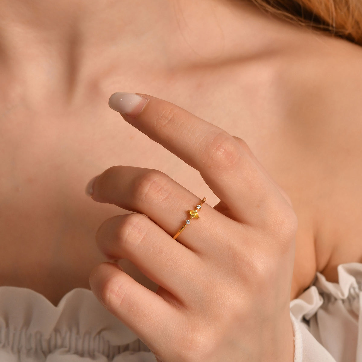 14K gold yellow-stone marquise diamond ring worn on hand