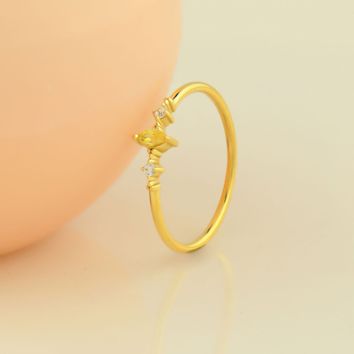10K gold yellow-stone marquise cubic zirconia ring on display