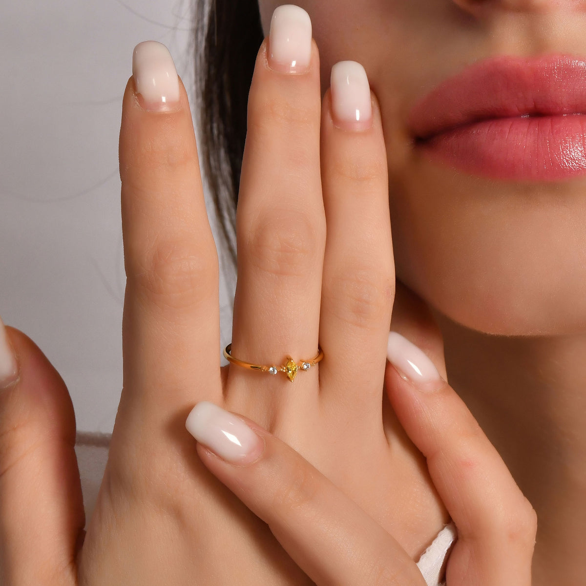 10K gold yellow-stone marquise cubic zirconia ring worn on hand