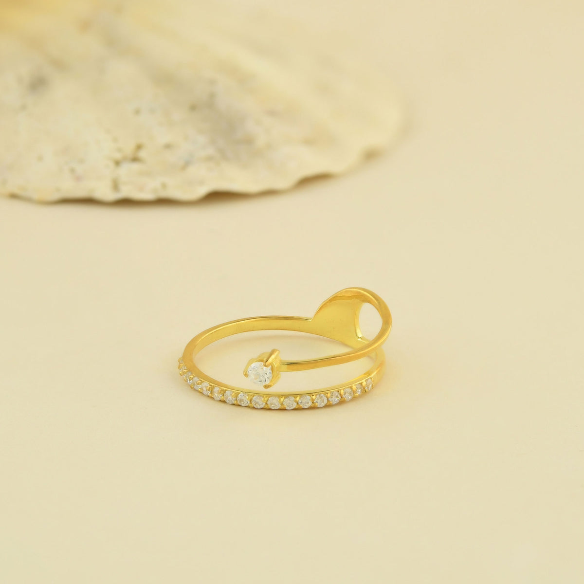 18K gold pave swirl diamond ring on display