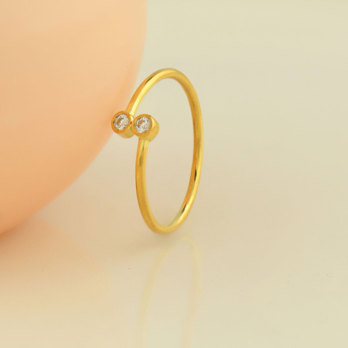 18K gold toi et moi bezel cubic zirconia ring on display
