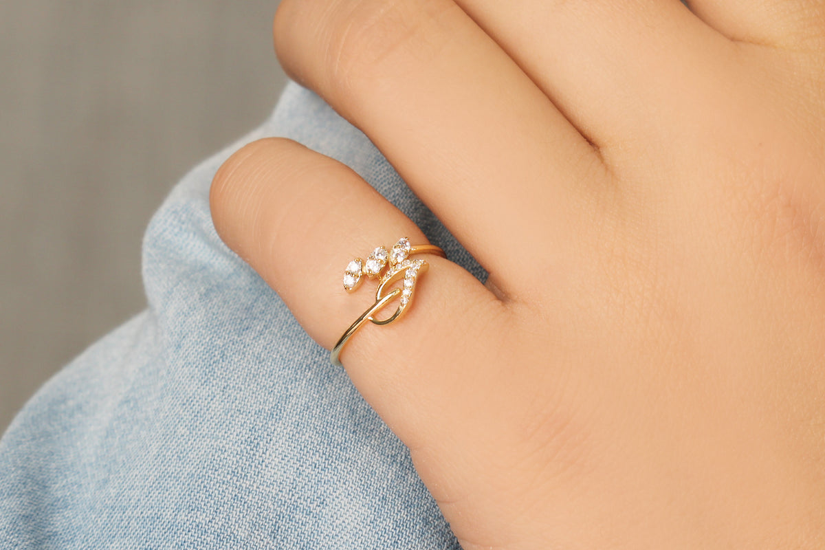 14K gold leaf ivy cubic zirconia ring on raised hand