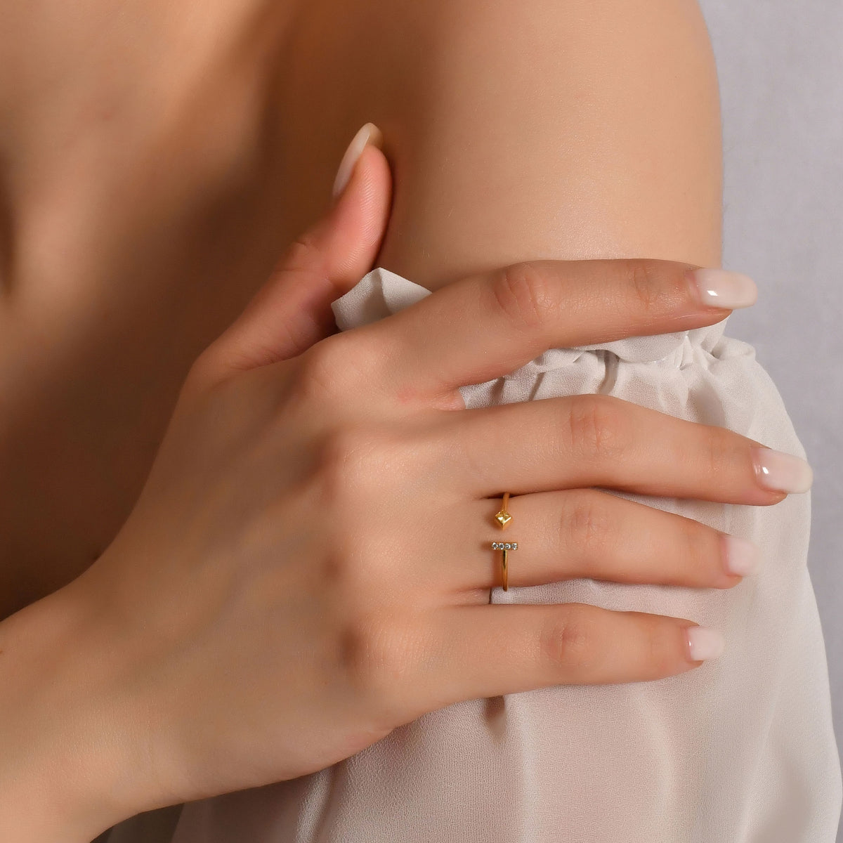10K gold yellow-stone open bar diamond ring worn on hand, side view