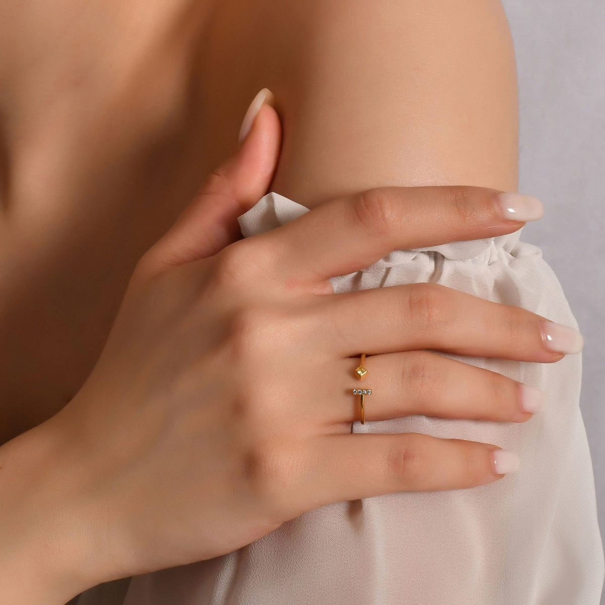 18K gold yellow-stone open bar diamond ring worn on hand, side view